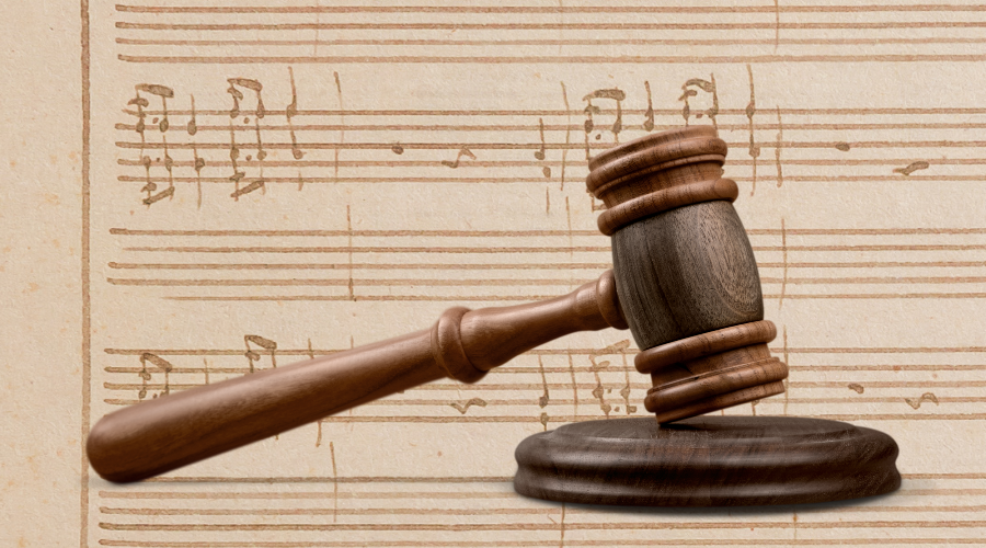 Sheet music and an auctioneer's gavel